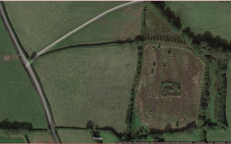 aerial view of the field before work started, it shows the single pond in one field, and the bales of rush dotted around the same field
